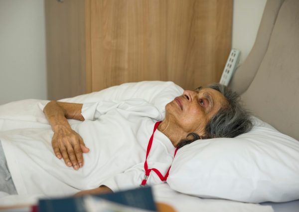 Frail,Old,Indian,Asian,Woman,Lying,In,Bed,In,A